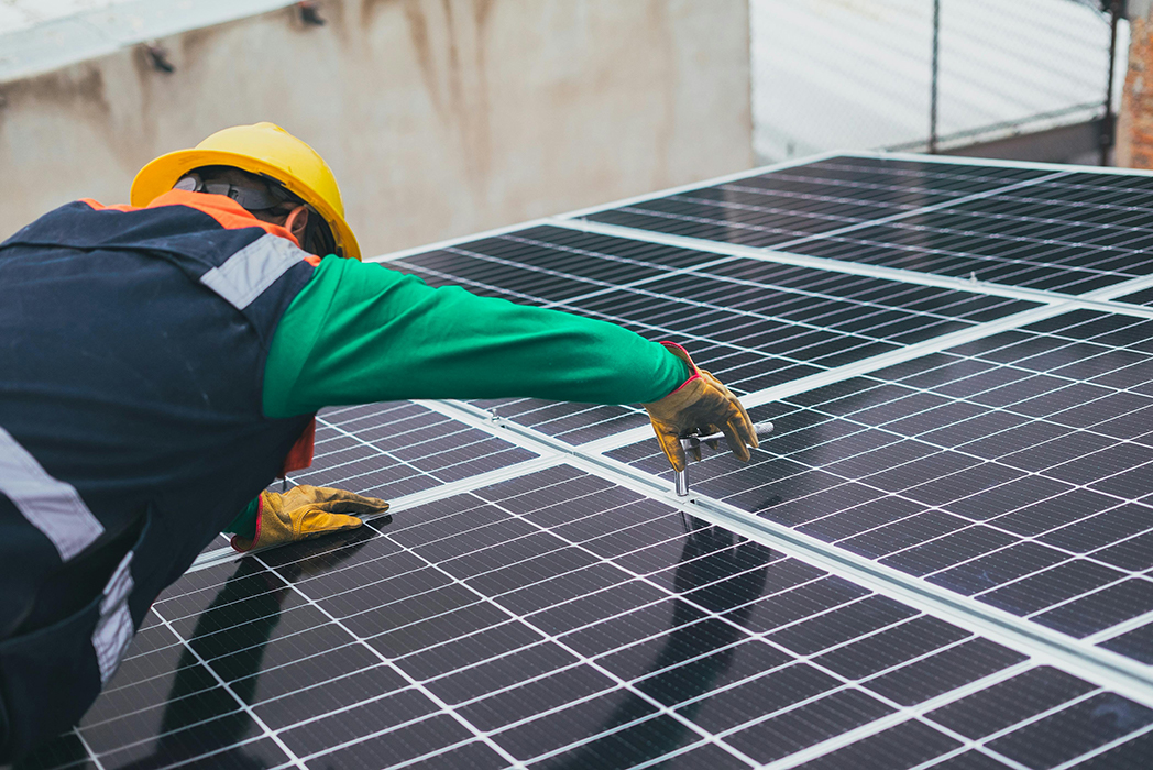 EcoGreenVision team installing energy-efficient systems in a commercial building