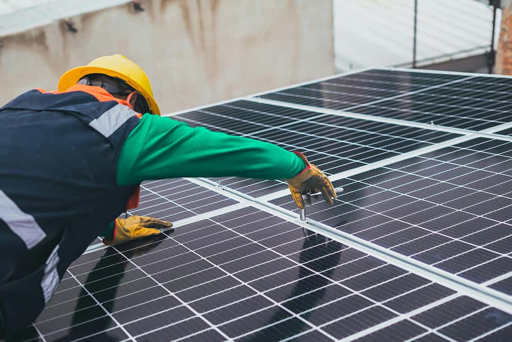 EcoGreenVision team installing energy-efficient systems in a commercial building